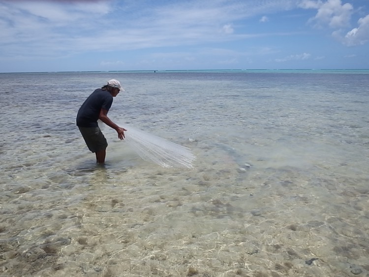 EPA scientist Danzel Narcis retrieving a cast net.