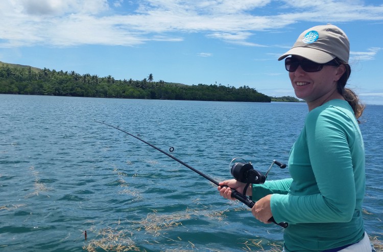 Adrienne Loerzel of NOAA's Coral Reef Conservation Program fishing for the project.