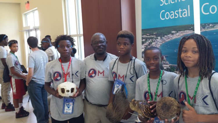 NCCOS scientist, Joe Wade (center), with students at the Lowcountry My Brother's Keeper Summer Camp. Credit NOAA