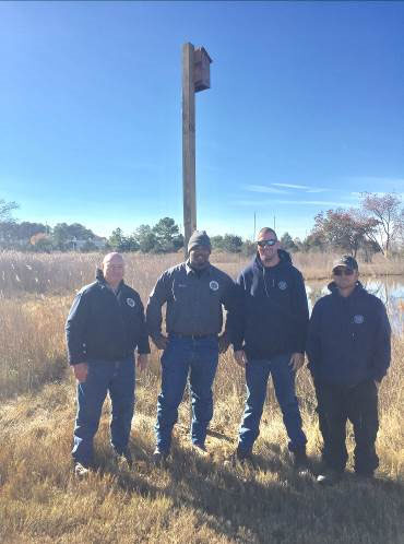 Town of Oxford Public Works crew and the bat house they installed at the NCCOS Cooperative Oxford Laboratory in Oxford, Maryland. 