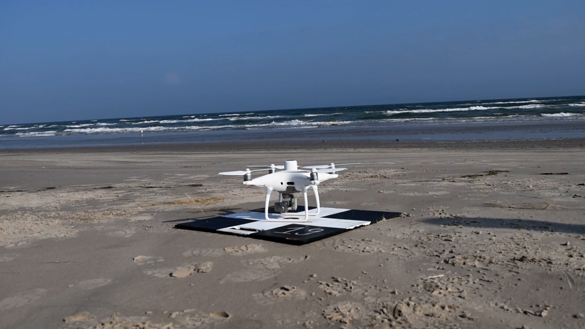 Aerial drone about to take off at beach near Corpus Christi, Texas, December 2021.