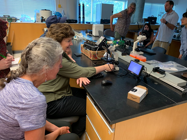 Dr. Margaret Mulholland from Old Dominion University (left) and Dr. Kim Reece from the Virginia Institute of Marine Science (center, at microscope) test the HABscope system during last month’s training. 