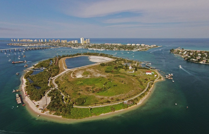 Aerial view of Peanut Island — built on dredged sediments — and Lake Worth Inlet, Florida. 