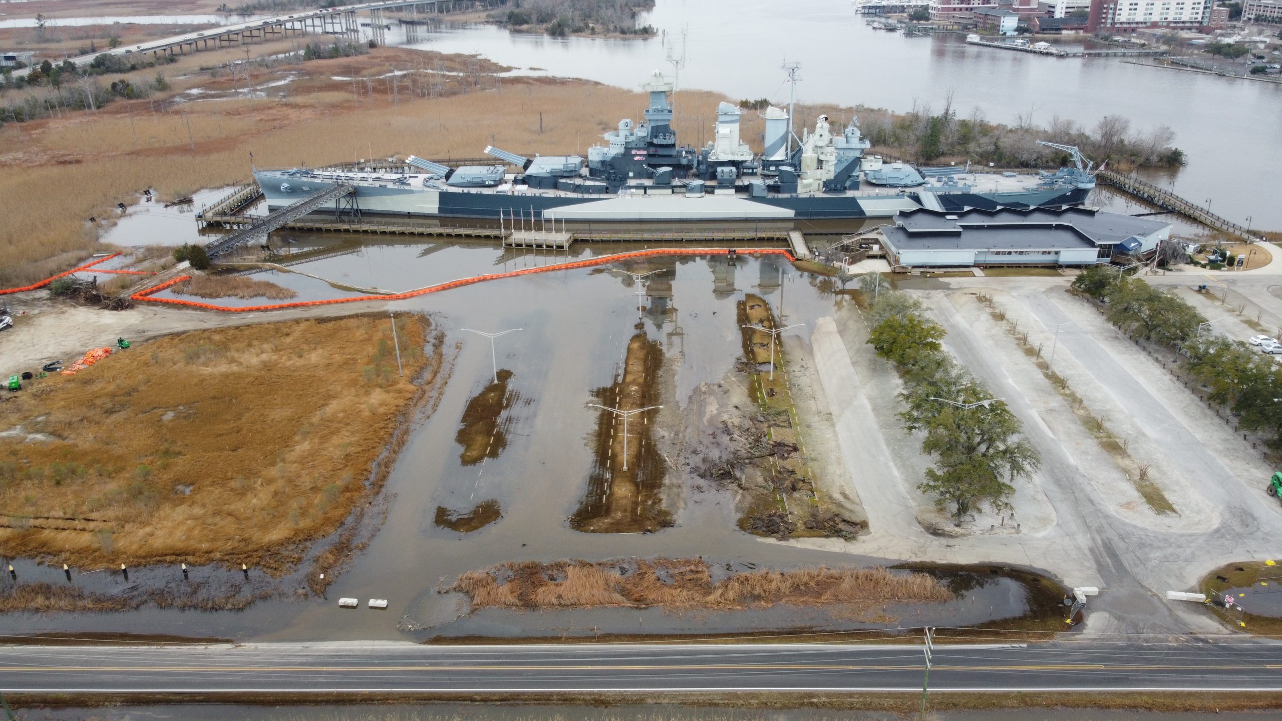Aerial view of USS North Carolina battleship berthed in Wilmington, North Carolina, along the Cape Fear River.